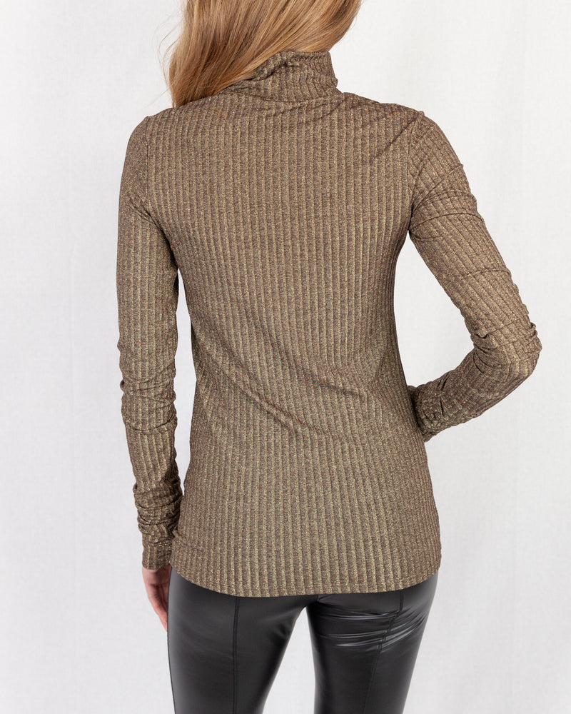 Gold Lurex Ribbed Turtle Neck. Slim Fitting With Extra Long Slim Sleeve. Below Hip Length 